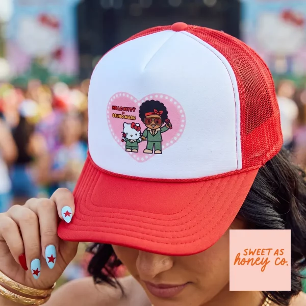 Hello Kitty and Bruno Mars The Romantic Tour 2026 Trucker Hat Merch 1 Close up of the Hello Kitty and Bruno Mars graphic print on a red trucker cap.