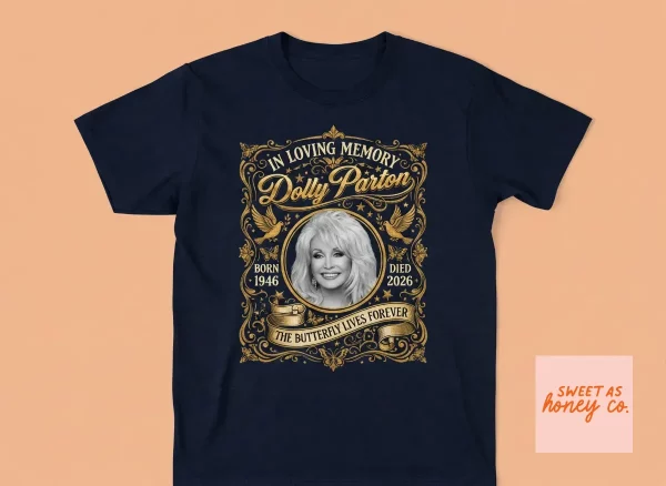 Dolly Parton Death In Loving Memory T-Shirt 1946 2026 2 Front view of a black Dolly Parton memorial T-shirt with gold filigree and portrait graphic. (Detail view #3)